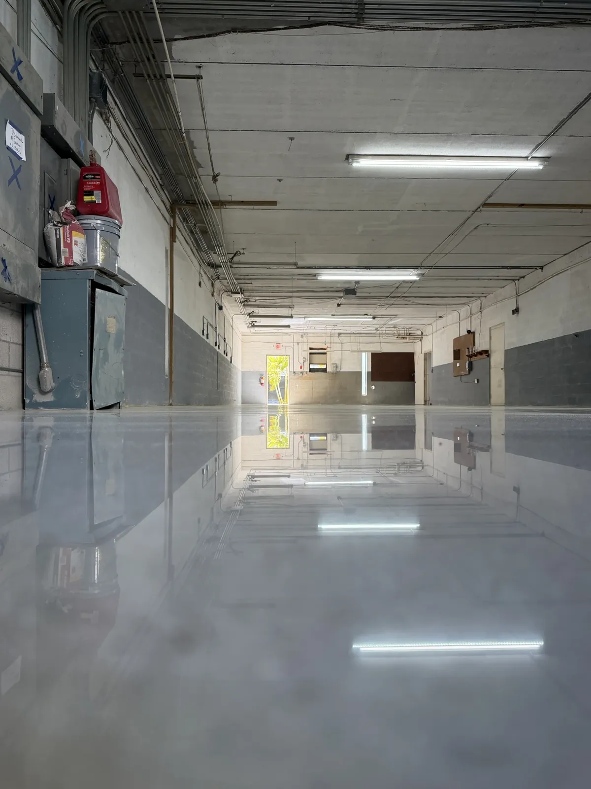After — Warehouse corridor with mirror-like light reflection
