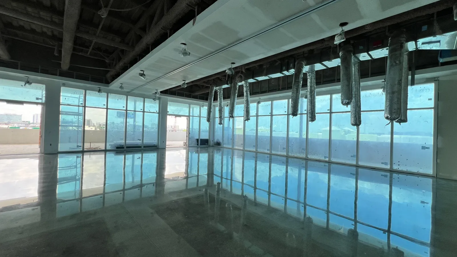 After — Polished floors reflecting the glass wing
