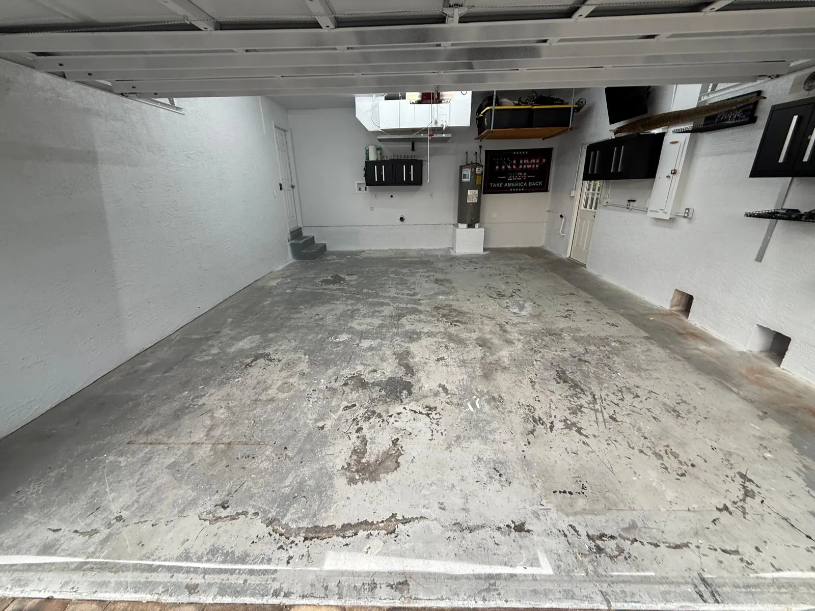 Damaged concrete garage floor Marco Island FL - before professional repair