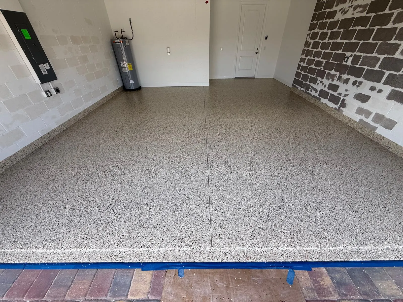 Repaired garage floor Fort Myers FL - Torginol flake system after crack repair